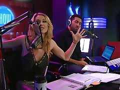 Playboy Radio's Morning Show has some of the hottest chicks you've ever seen! They're talking about Halloween costumes, and their guest has a cop outfit on that looks sexy as hell. It gets even sexier when her top comes off, baring her tits. The female host comes over and helps shorten the skirt.