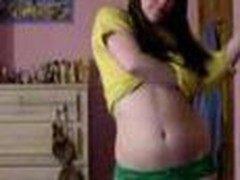 Youthful legal age teenager bedroom strip, yellow top and little green pants cast aside showing her little tits and pussy.